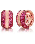 Ouro Pink Sapphire Hoop Earrings with a golden band nestled amidst a sea of pink sapphires in vivid pink rhodium