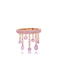 Pink sapphire floating ring with multiple stones arranged in a floating design, set in 18K rose gold.