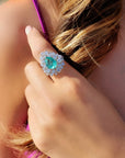image of model wearing the stunning Graziela Paraiba tourmaline and diamond double halo ring